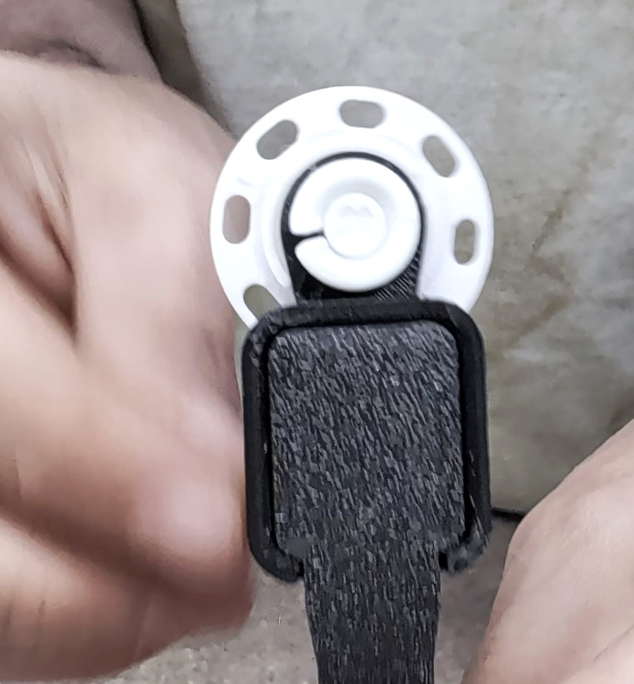 Finished white post and retaining ring beside the black Standard TPU strap/base.